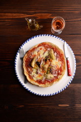 Pizza with artichokes and bacon