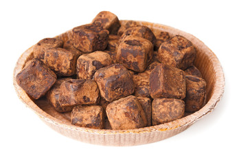 Chocolate truffles on white background