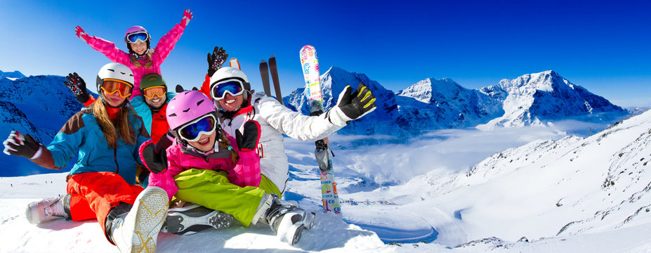 Skiing, panorama - family enjoying winter vacation