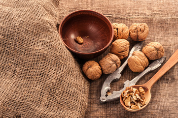 Fototapeta na wymiar peeled nuts with shell on sacking