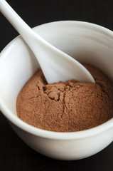 Red cosmetic clay in a bowl