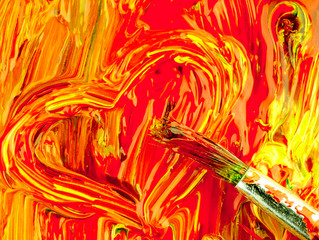 Colored paint mixed on palette. Dirty brush and heart shape.