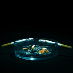 Ashtray and Two Cigarettes