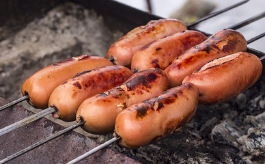 Grilled sausage on the grill