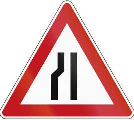 German sign indicating narrowing of the road only on the left