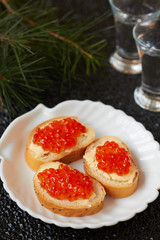 Canape with red caviar and butter