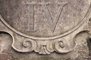 Roman number IV written on stucco wall