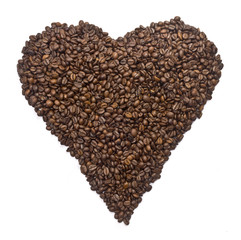 Coffee beans aligned to shape a heart