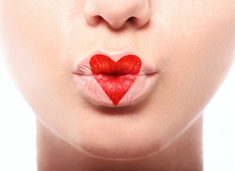 Kissing lips with lovely red make up at the heart shape