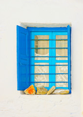 blue window in Chora the capital of Amorgos island in Greece