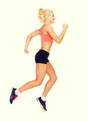 Fototapeta na wymiar sporty woman running or jumping