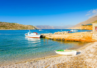 Old fishing boats by the sea in Amorgos island in Greece
