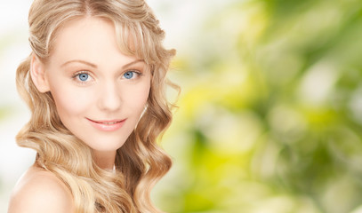 Naklejka premium face of beautiful young happy woman with long hair