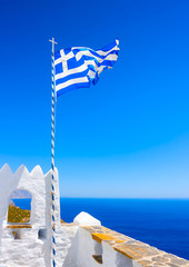 Greek flag at Hozoviotissa Monastery in Amorgos island in Greece - 76334550