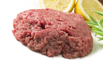 Minced horse meat with spice on the white