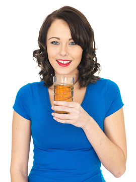 Attractive Young Woman Drinking Apple Juice