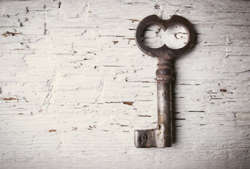 Old key on wooden table
