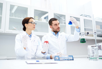 Fototapeta premium young scientists making test or research in lab