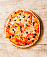 pizza on the wood background