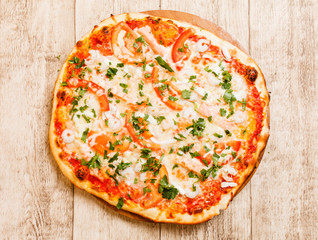 pizza on the wood background