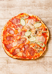 pizza on the wood background