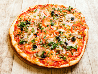 pizza on the wood background