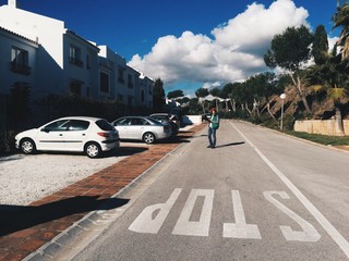 Naklejka na ściany i meble Man stays in center if road and thinks where to go