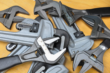 set of hand tools on a wooden background