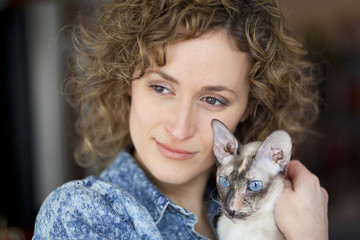 Close-up of a woman and cat