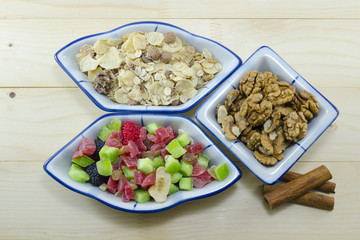 Muesli, walnuts and dried fruit on a table