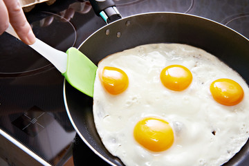 Fried eggs on frying pan