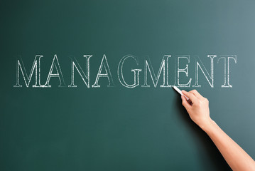 management written on blackboard