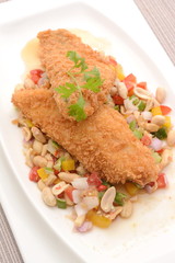 Fried fish with herb salad