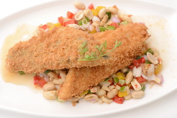 Fried fish with herb salad