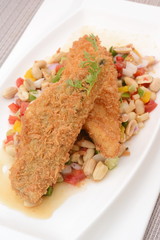 Fried fish with herb salad
