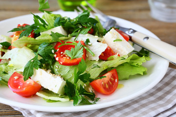 Fresh salad with vegetables and cheese