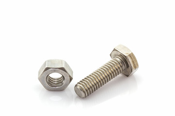 Metal screw and nuts on white background.