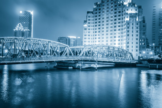 Shanghai Waibaidu bridge panorama at night with colorful light o
