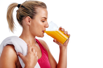 Workout woman drinking juice
