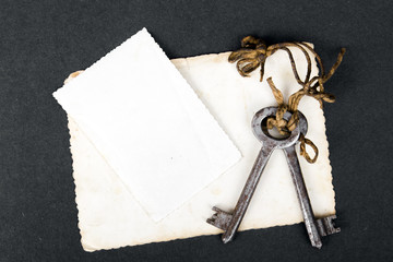 Rusty key and empty photography as a memory metaphor