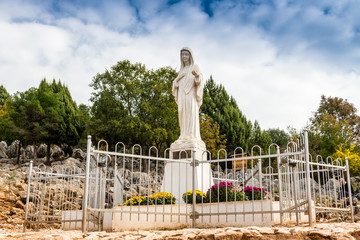 Blessed Virgin Mary Statue on Apparition hill - obrazy, fototapety, plakaty