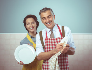 Vintage couple dish washing together
