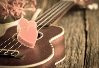 Red heart with guitar.