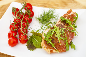 piece of crude meat and seasoning