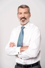 Successful businessman with folded arms