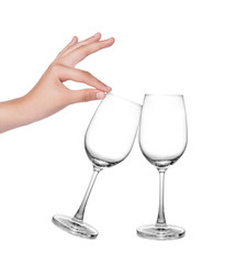 Hand holding Empty glass isolate on white