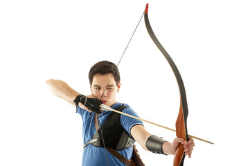Boy shooting with a longbow - 76359986