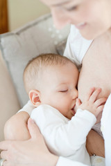 Mother breastfeeding cute baby
