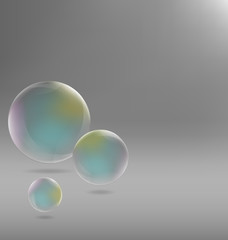 Three transparent soap bubbles with shadows on grayscale backgro