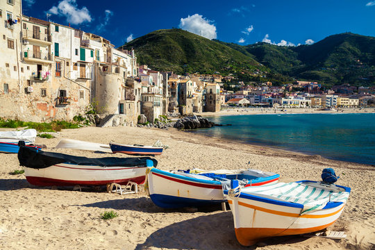 wooden fishing boats on the old beach of Cefalu